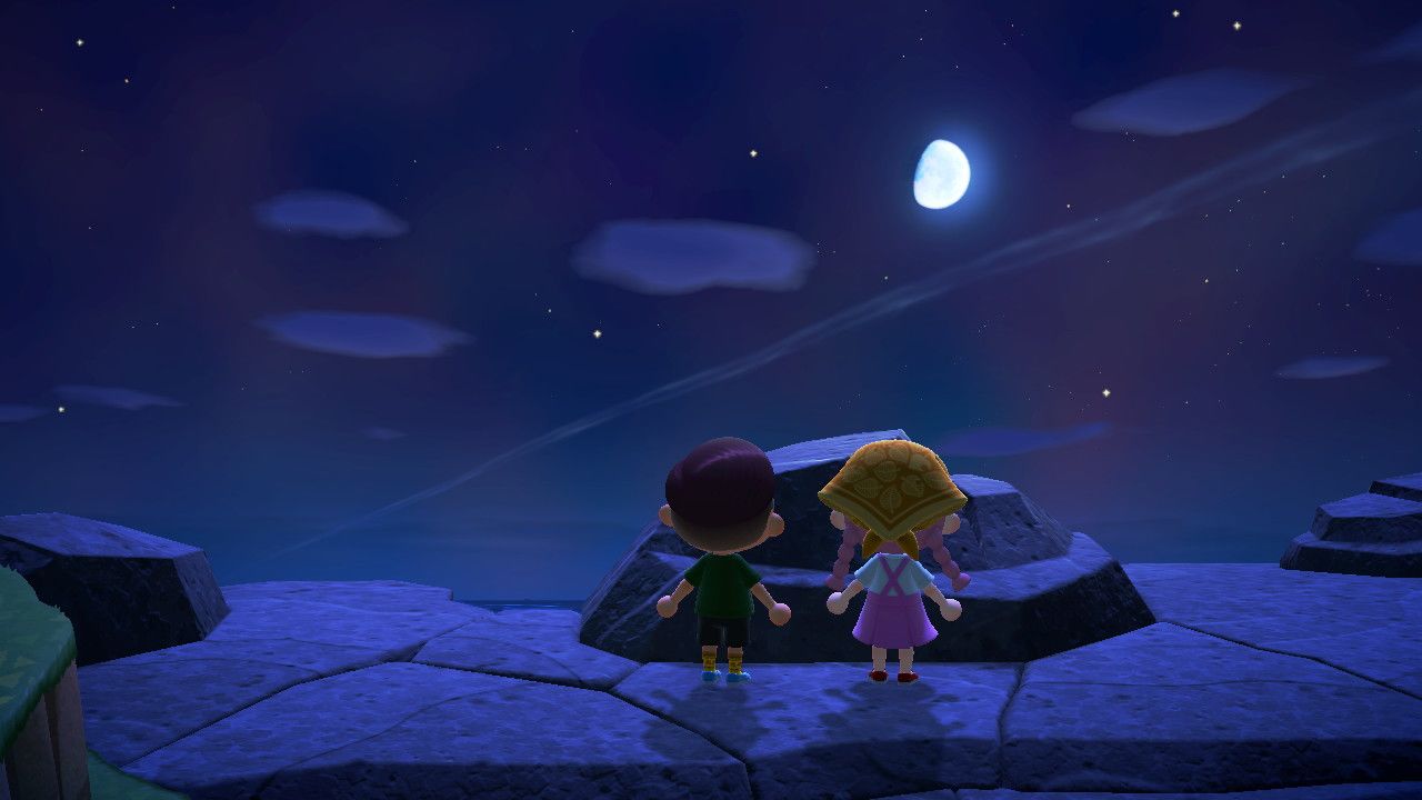 Players staring up at a moon